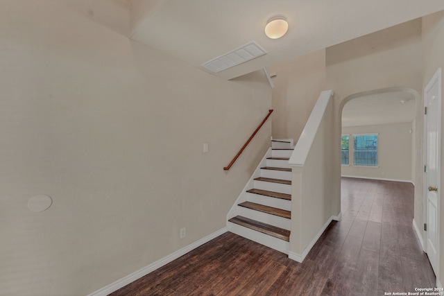 stairs with hardwood / wood-style flooring