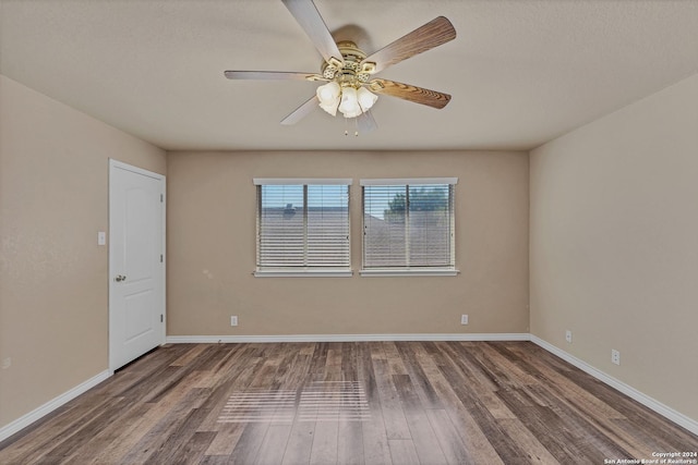235 Hondo Dr, New Braunfels, TX 78130 - spare room featuring wood finished floors, a ceiling fan, and baseboards