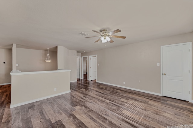 unfurnished living room featuring wood-type flooring and ceiling fan