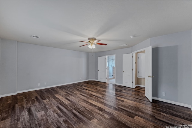 spare room featuring ceiling fan and dark hardwood / wood-style floors