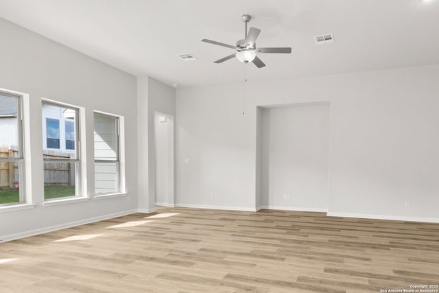 unfurnished room with light wood-type flooring and ceiling fan