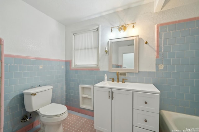 bathroom with vanity, a bath, tile walls, and toilet