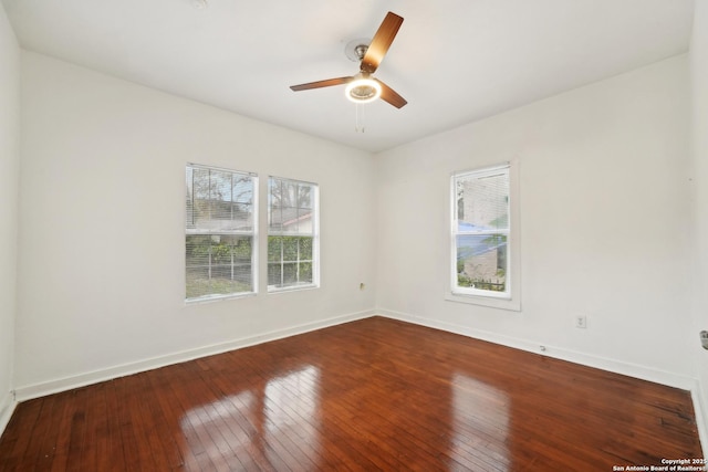 spare room featuring ceiling fan and hardwood / wood-style floors