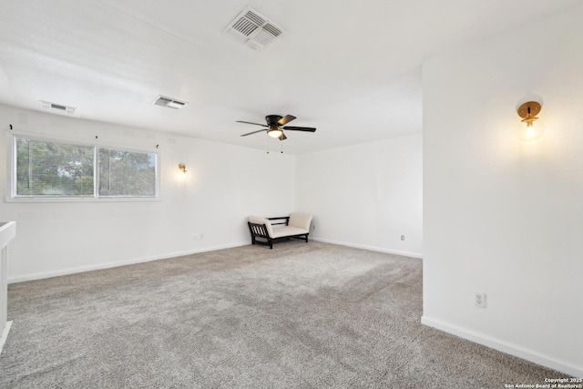 carpeted empty room with ceiling fan