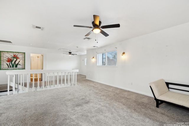 unfurnished room featuring carpet flooring and ceiling fan