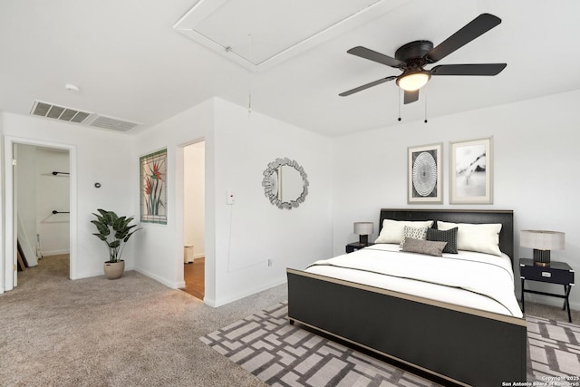 carpeted bedroom featuring ceiling fan