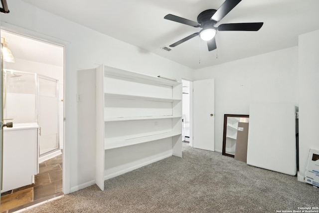 unfurnished bedroom with carpet floors and ceiling fan