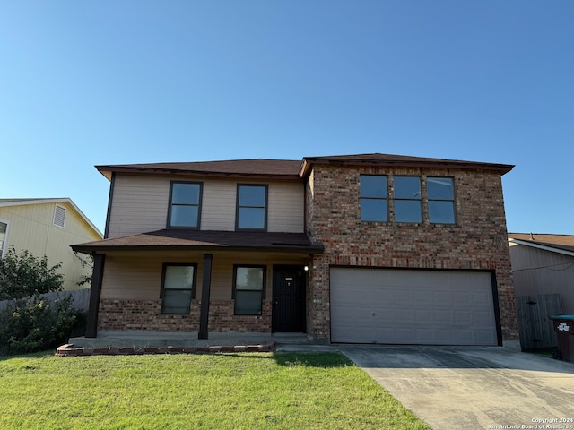 view of front of home featuring a garage and a front lawn