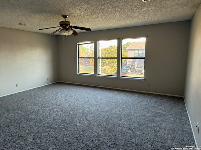 unfurnished room featuring a textured ceiling, carpet flooring, and ceiling fan