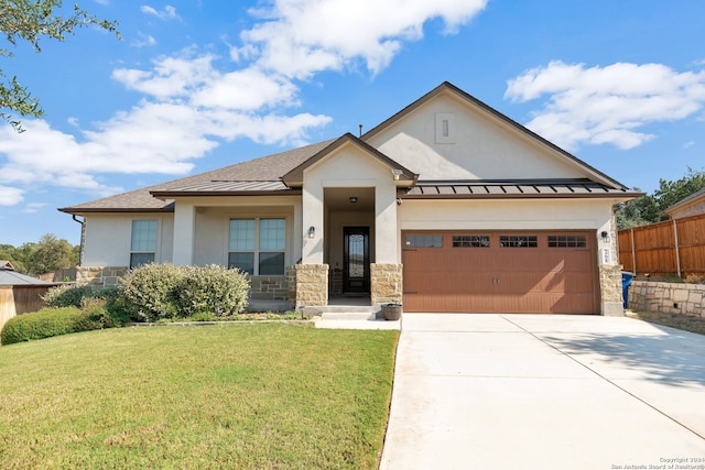 view of front of property with a garage and a front yard