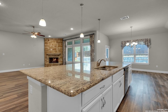 kitchen featuring white cabinets, dark hardwood / wood-style flooring, a center island with sink, and stainless steel dishwasher