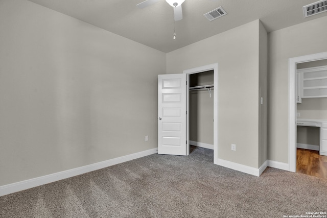 unfurnished bedroom with ceiling fan and carpet floors