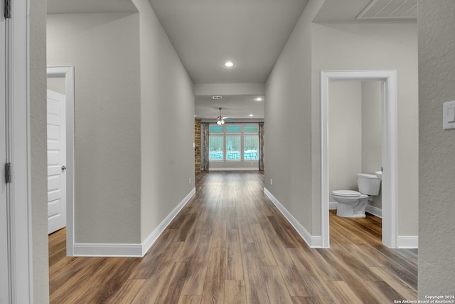 hallway featuring hardwood / wood-style flooring