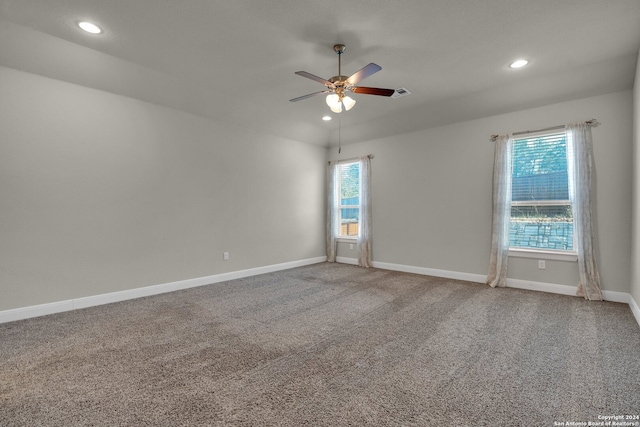 spare room with ceiling fan and carpet floors