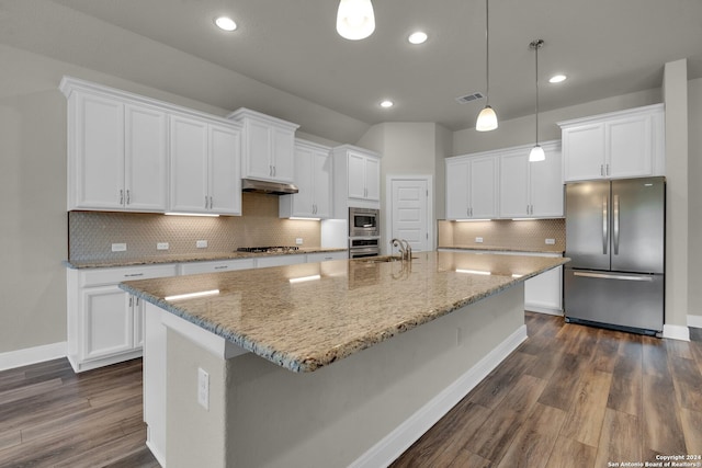 kitchen featuring dark hardwood / wood-style floors, white cabinetry, a kitchen island with sink, and appliances with stainless steel finishes