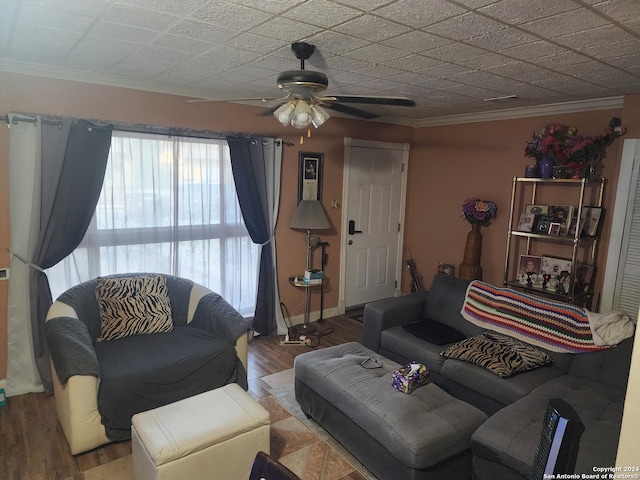 living room featuring crown molding, hardwood / wood-style floors, and ceiling fan