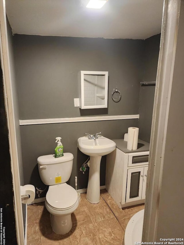 bathroom featuring tile patterned floors and toilet