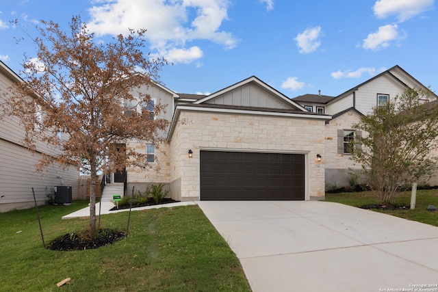 view of front of home with a front lawn and central AC unit