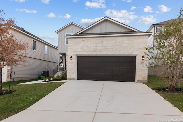 view of front of home featuring a garage and a front lawn