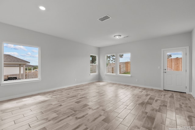 spare room featuring light wood-type flooring