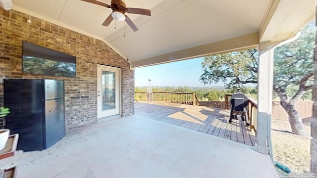 view of patio with ceiling fan and a wooden deck