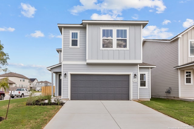 view of front of home featuring a front lawn and a garage