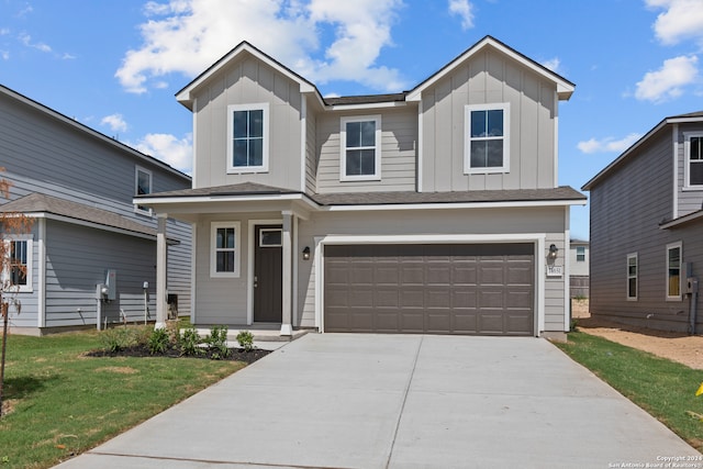 view of front of home featuring a garage and a front yard