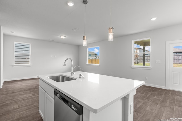 kitchen with a kitchen island with sink, dark hardwood / wood-style flooring, sink, dishwasher, and white cabinets