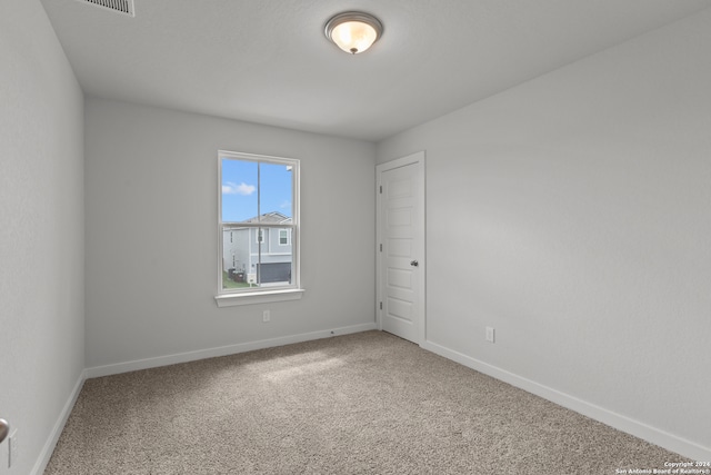 empty room featuring carpet flooring