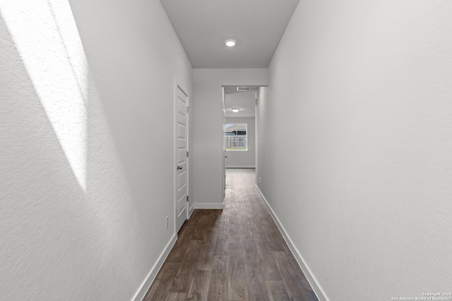 hall with dark hardwood / wood-style floors