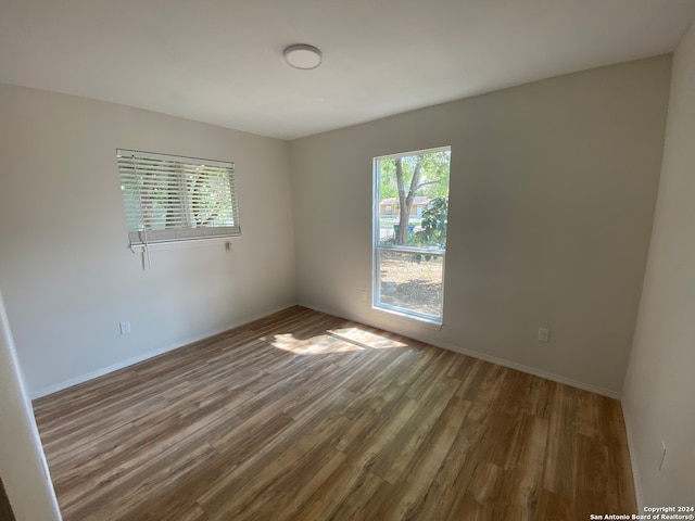 empty room featuring hardwood / wood-style floors