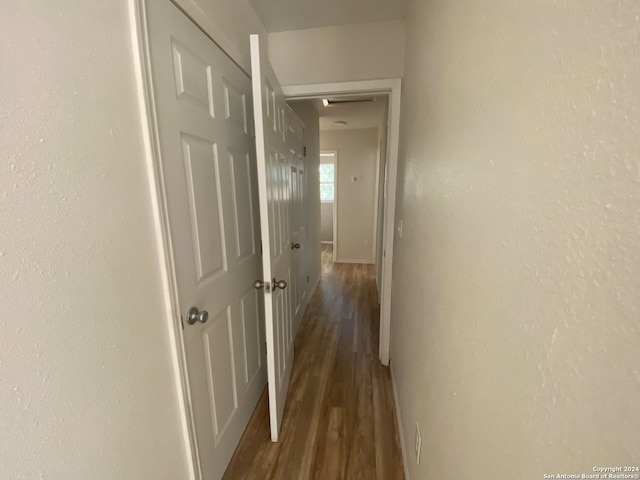 hallway with dark hardwood / wood-style floors