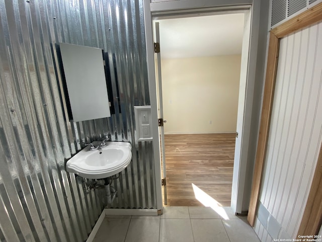 bathroom with sink and tile patterned flooring