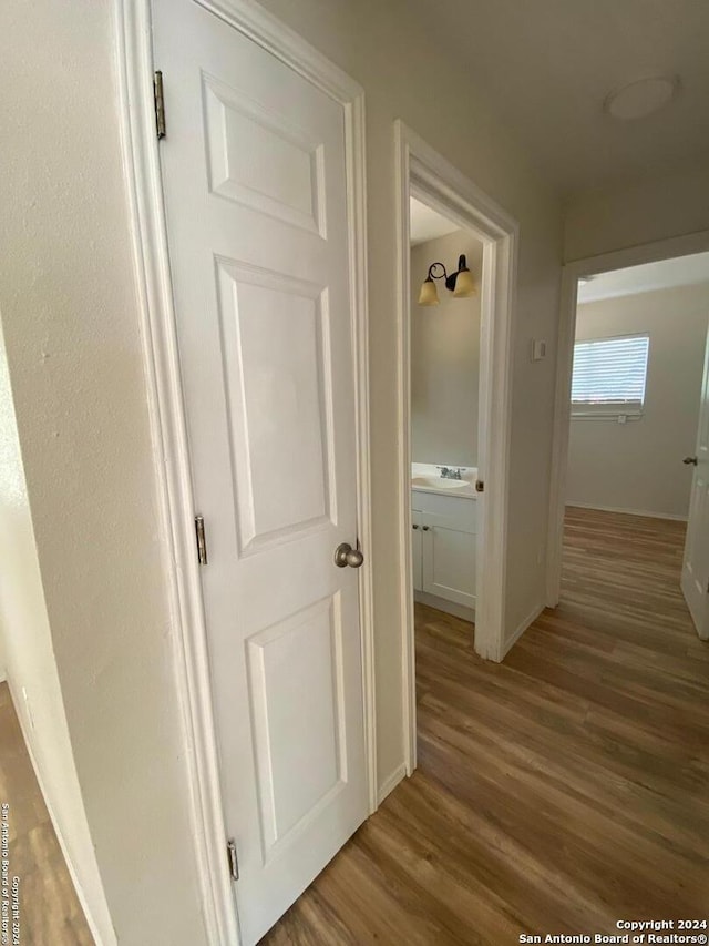 corridor featuring hardwood / wood-style flooring