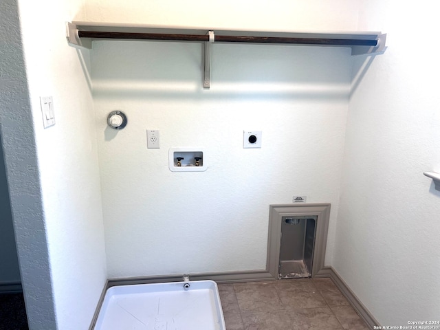 washroom with hookup for a washing machine, light tile patterned flooring, hookup for a gas dryer, and hookup for an electric dryer