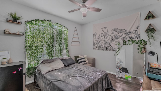 bedroom featuring dark hardwood / wood-style floors and ceiling fan