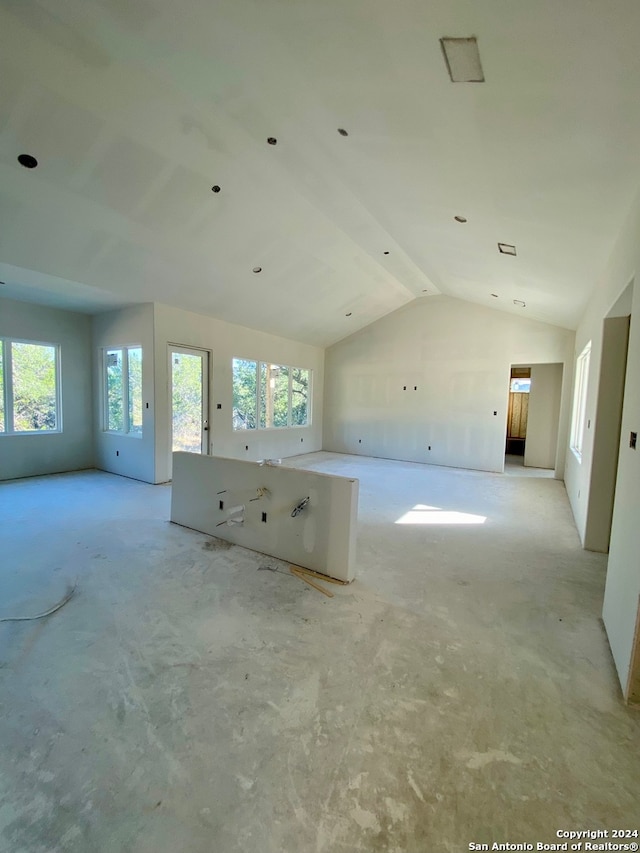 spare room featuring vaulted ceiling