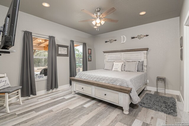 bedroom featuring ceiling fan and light wood-type flooring