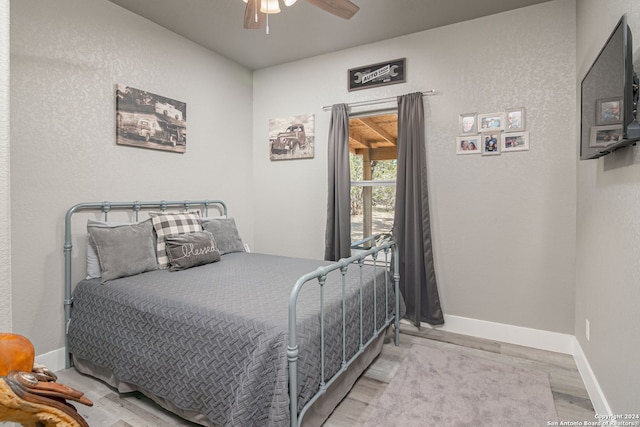 bedroom featuring ceiling fan and light hardwood / wood-style flooring