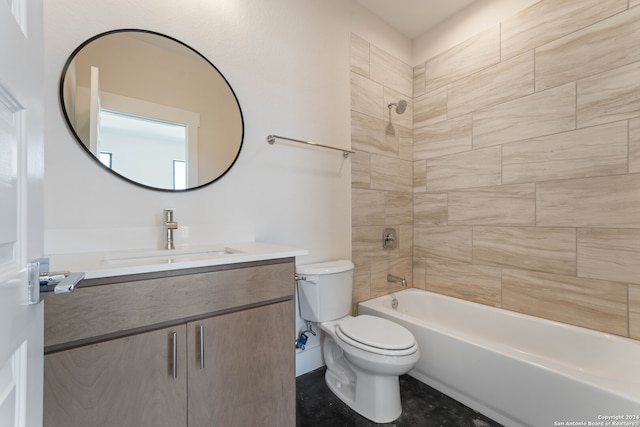 full bathroom with tiled shower / bath combo, vanity, and toilet