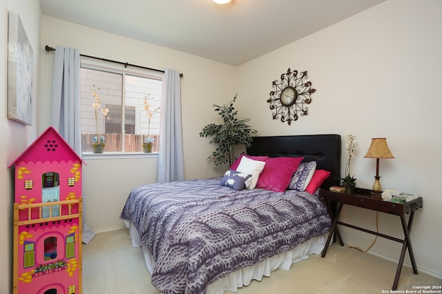 bedroom with light colored carpet