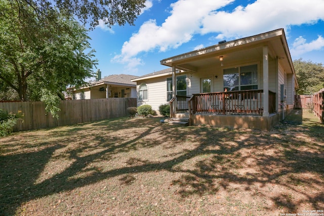 back of house with a yard