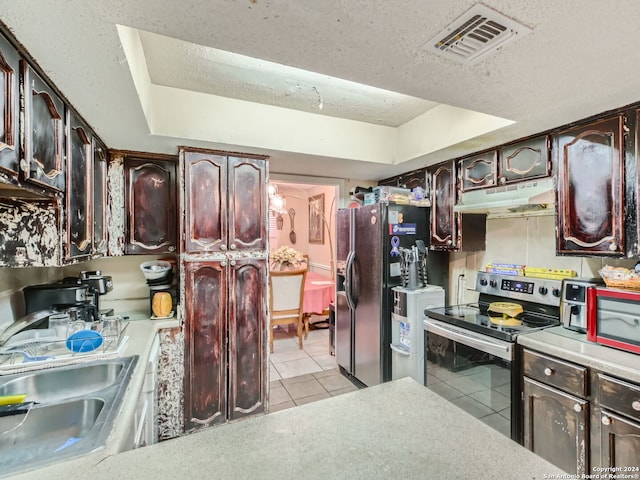 kitchen featuring light tile patterned floors, sink, stainless steel electric range, a tray ceiling, and refrigerator with ice dispenser