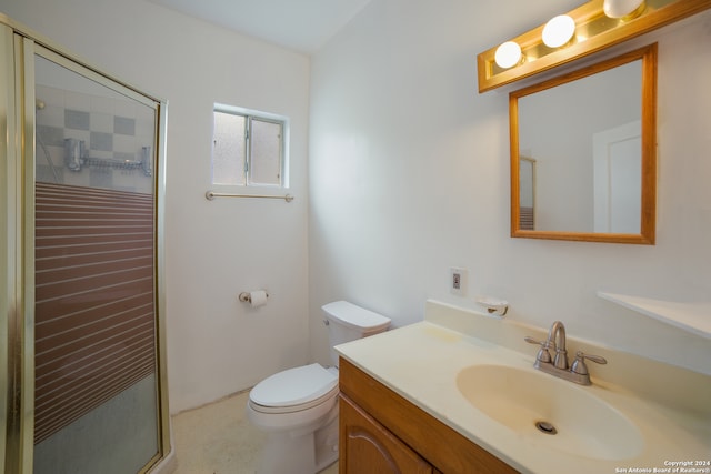 bathroom featuring walk in shower, vanity, and toilet