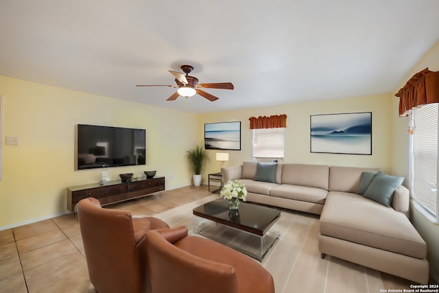 tiled living room featuring ceiling fan