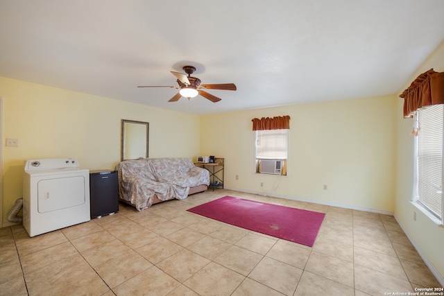 interior space featuring ceiling fan, light tile patterned floors, and washer / dryer