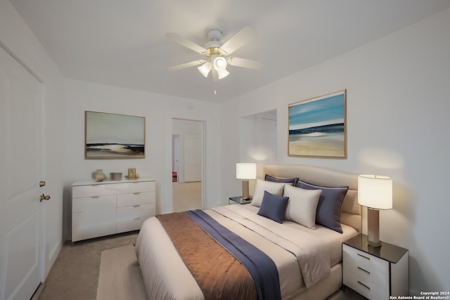 bedroom featuring ceiling fan and light carpet