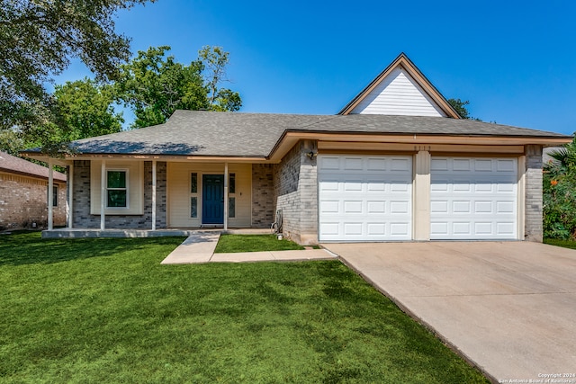 single story home featuring a porch, a front yard, and a garage