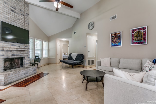 tiled living room featuring ceiling fan, a brick fireplace, beam ceiling, and high vaulted ceiling