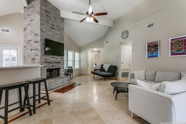 living room featuring a brick fireplace, beam ceiling, high vaulted ceiling, and ceiling fan